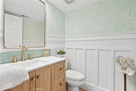 a utility room with sink dryer and washer