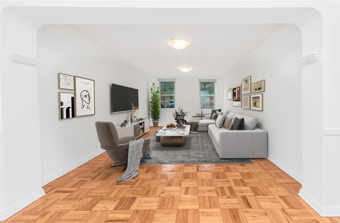 821 Bronx River Road, Unit 1E Bronxville, NY 10708 - Photo 1 of 1 a living room with furniture and a flat screen tv