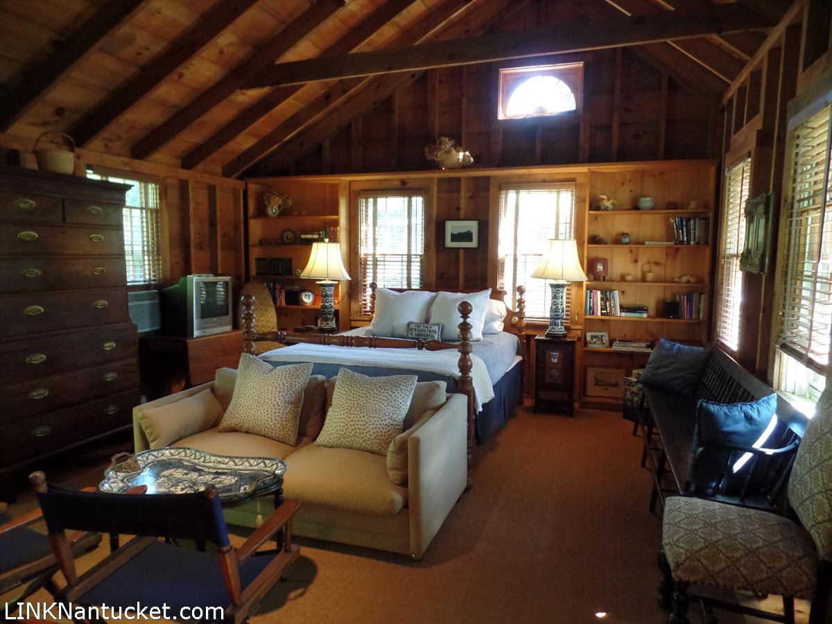 3 West Dover Street Nantucket, MA 02554 - Photo 2 of 4 a living room with furniture a ceiling fan and a window