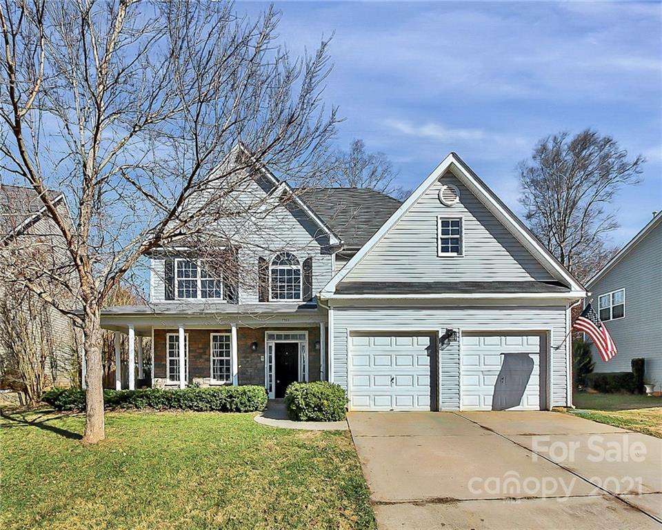 7769 East Berkeley Road Denver, NC 28037 - Photo 2 of 31 a front view of a house with a yard