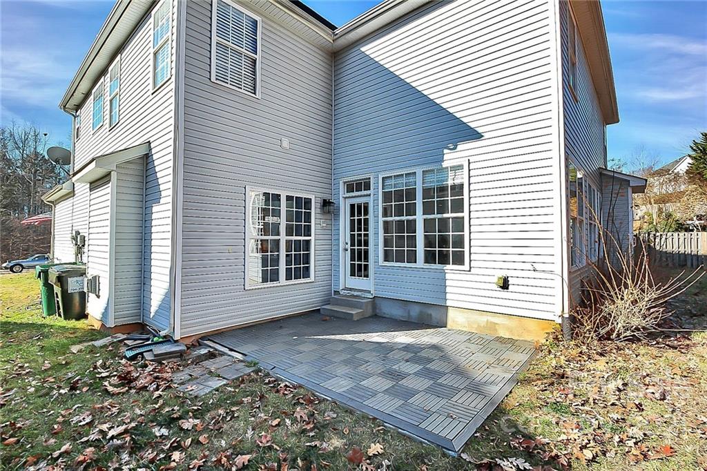 7769 East Berkeley Road Denver, NC 28037 - Photo 29 of 31 a view of a house with a door and a window