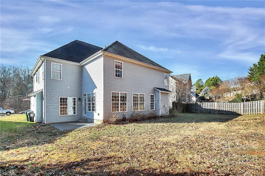 7769 East Berkeley Road Denver, NC 28037 - Photo 31 of 31 a front view of a house with garden