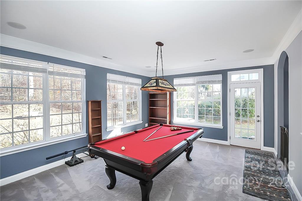 7769 East Berkeley Road Denver, NC 28037 - Photo 6 of 31 a room with pool table and windows