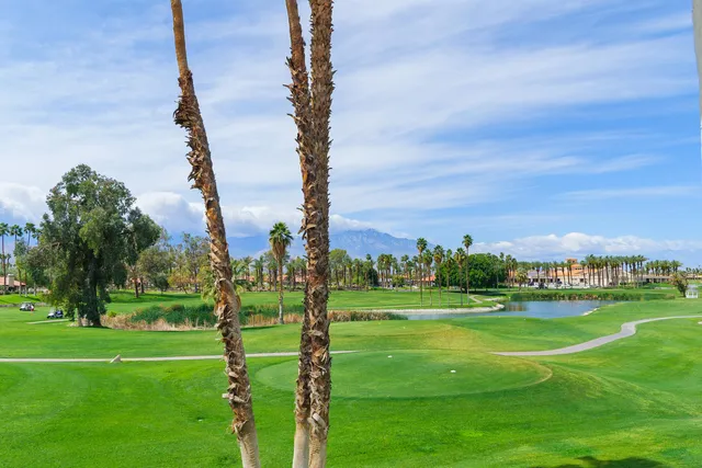 a view of a golf course with a big yard