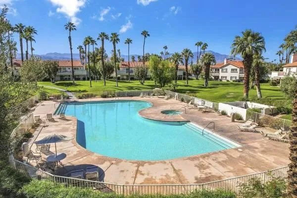 a view of a swimming pool with a yard