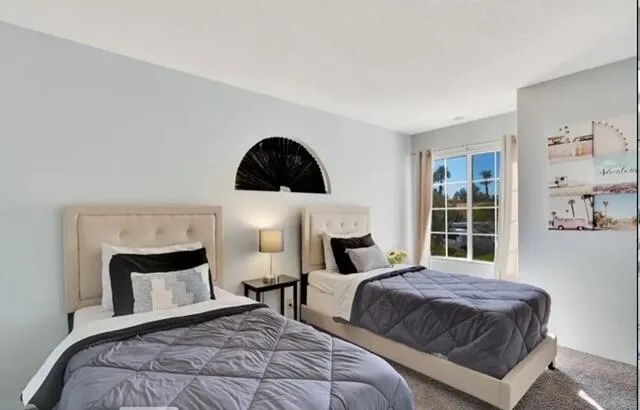 a bedroom with a bed a mirror and a window