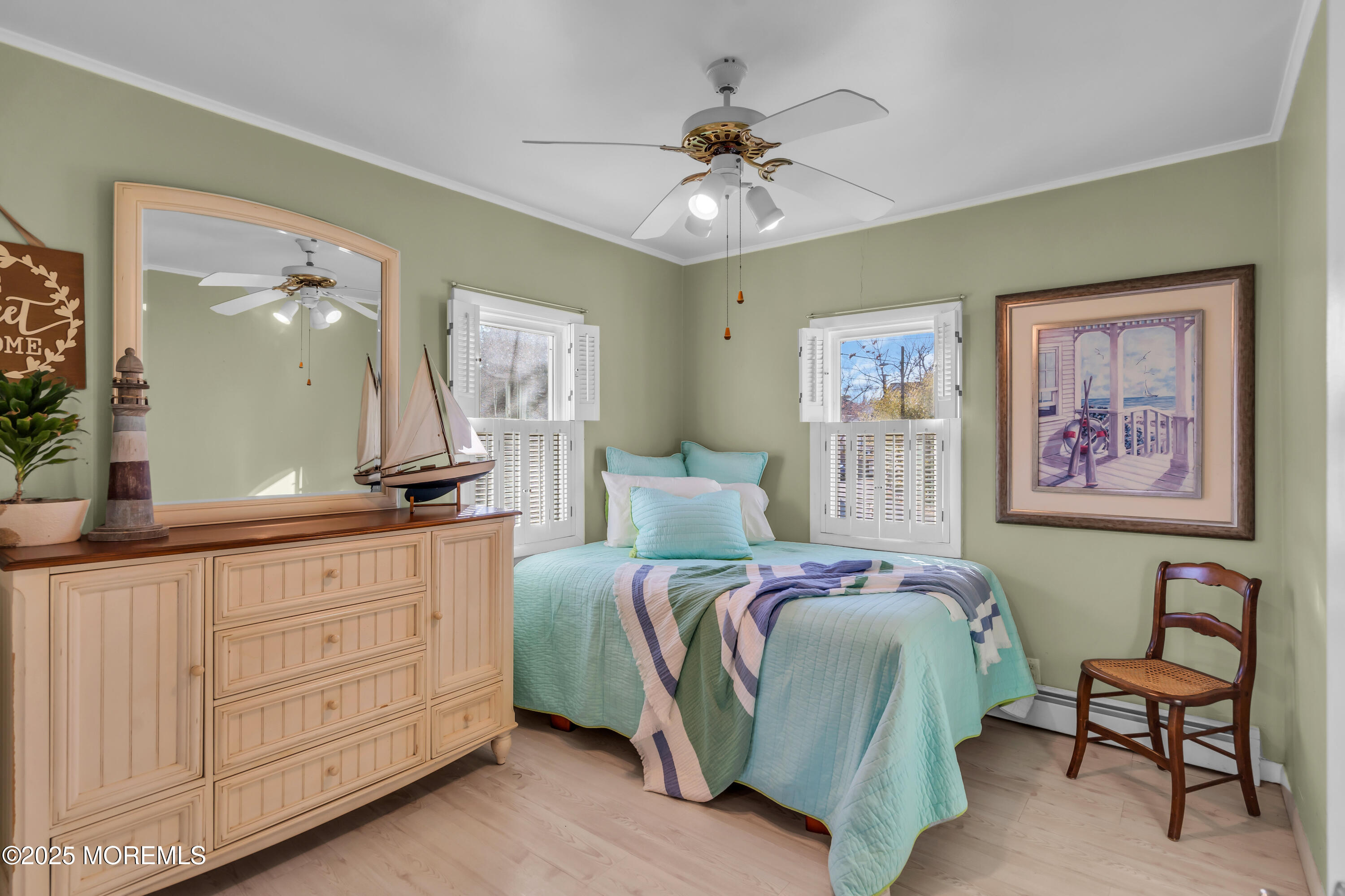 3 Metedeconk Road Brick, NJ 08723 - Photo 14 of 28 a bedroom with a bed and a chandelier