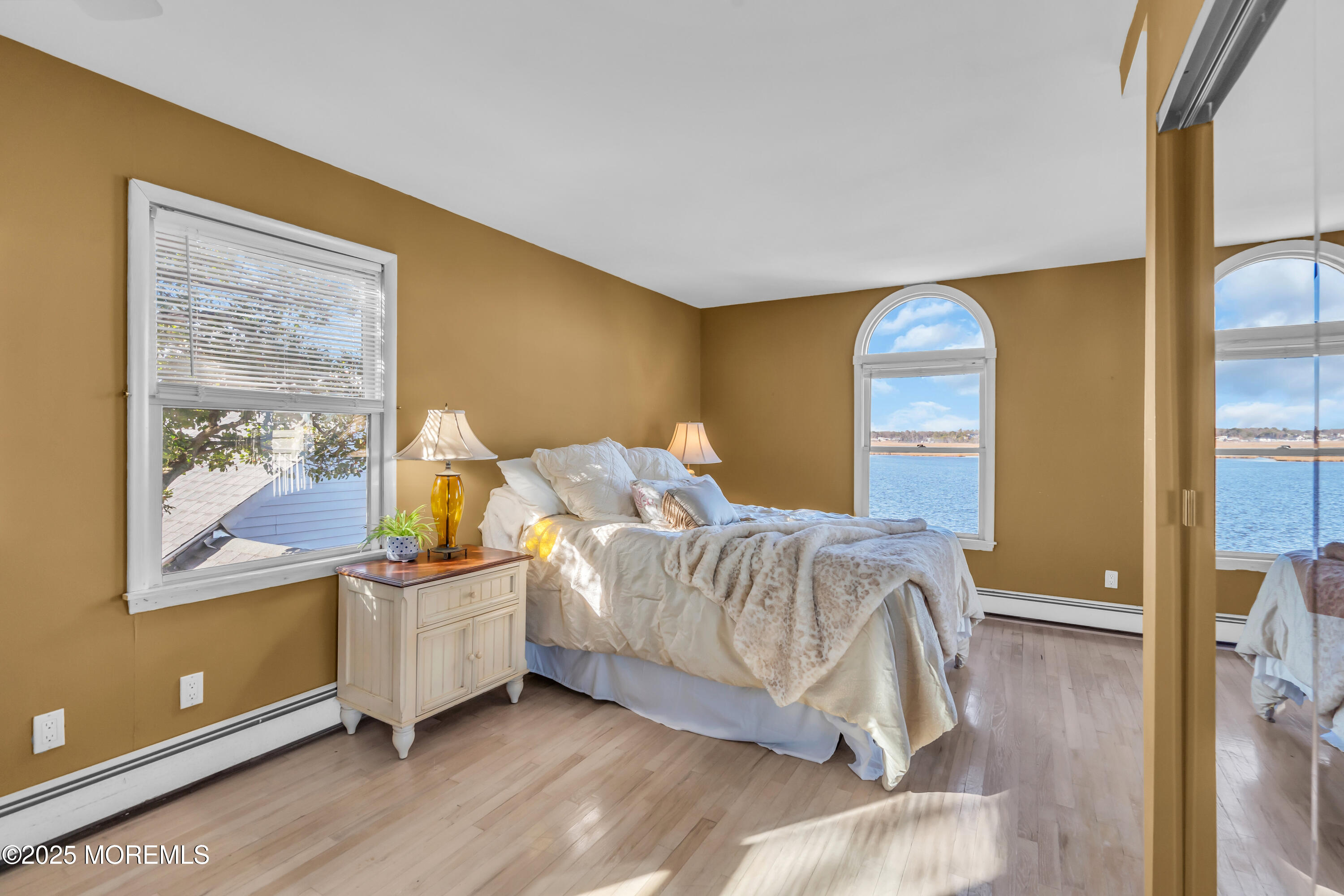 3 Metedeconk Road Brick, NJ 08723 - Photo 18 of 28 a bed room with a bed and a painting on the wall