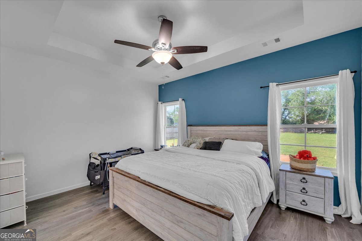144 Summit Drive Byron, GA 31008 - Photo 15 of 42 a bedroom with a bed and a dresser