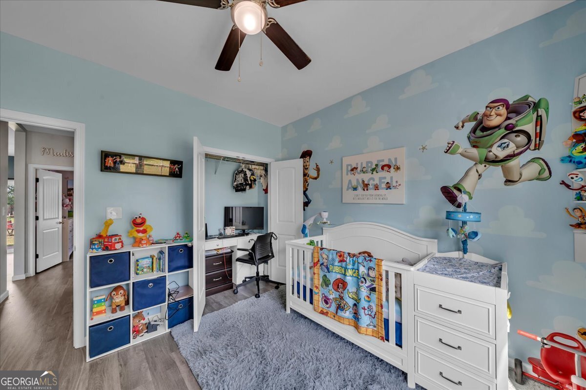 144 Summit Drive Byron, GA 31008 - Photo 24 of 42 a bedroom with furniture and a bed
