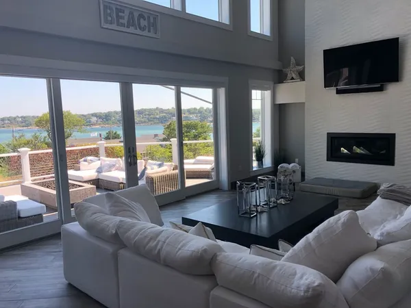 a living room with fireplace furniture and a flat screen tv