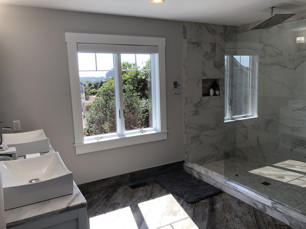 15 Wyoma Road Gloucester, MA 01930 - Photo 6 of 11 a bathroom with a sink and a mirror