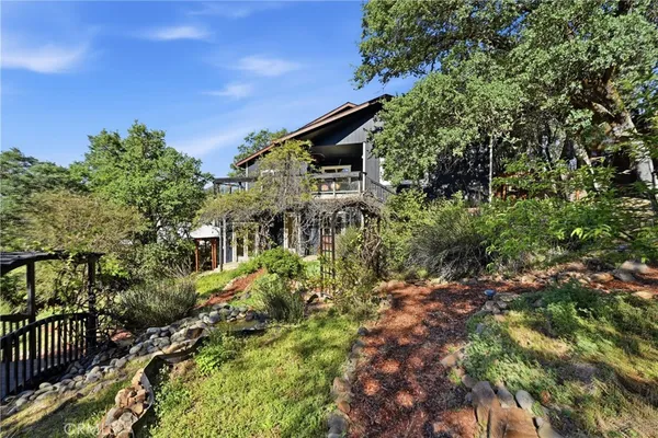 a view of a house with a tree in the background