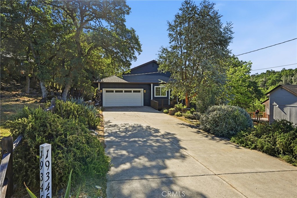 19345 Moon Ridge Road Hidden Valley Lake, CA 95467 - Photo 3 of 64 a front view of a house with a yard