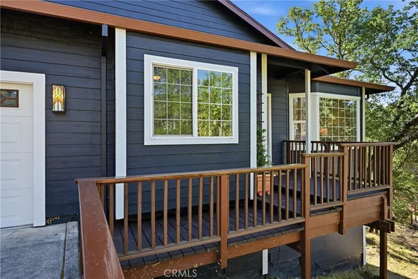 a view of a chair and table in the porch