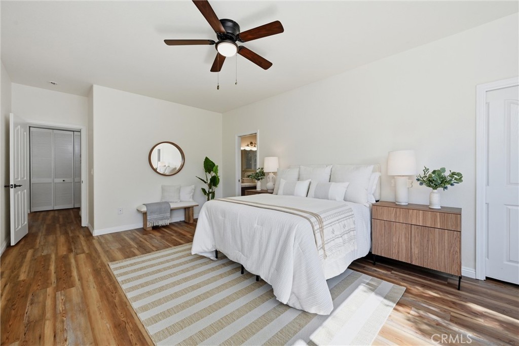 19345 Moon Ridge Road Hidden Valley Lake, CA 95467 - Photo 57 of 64 a bedroom with a bed and a chandelier