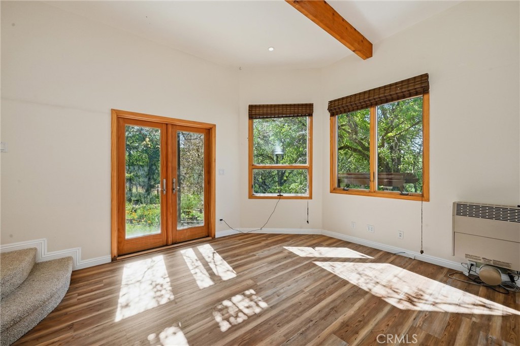 19345 Moon Ridge Road Hidden Valley Lake, CA 95467 - Photo 59 of 64 a view of an empty room with wooden floor and a window