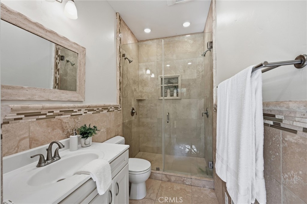 19345 Moon Ridge Road Hidden Valley Lake, CA 95467 - Photo 64 of 64 a bathroom with a sink toilet a shower and a mirror