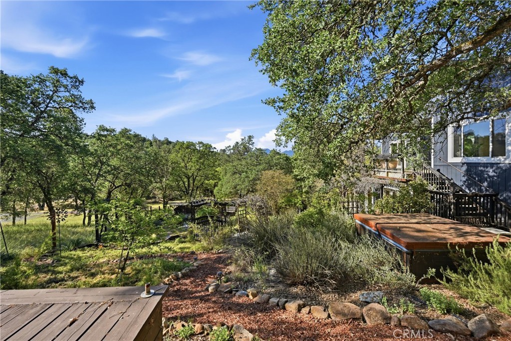 19345 Moon Ridge Road Hidden Valley Lake, CA 95467 - Photo 10 of 64 a backyard of a house with lots of green space