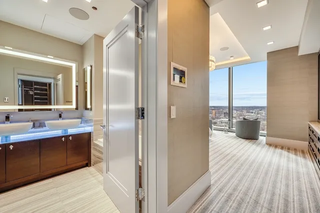 a kitchen with stainless steel appliances a sink and a refrigerator