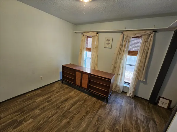 a view of entryway with wooden floor and door