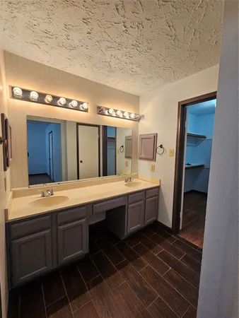 a bathroom with a bathtub and shower