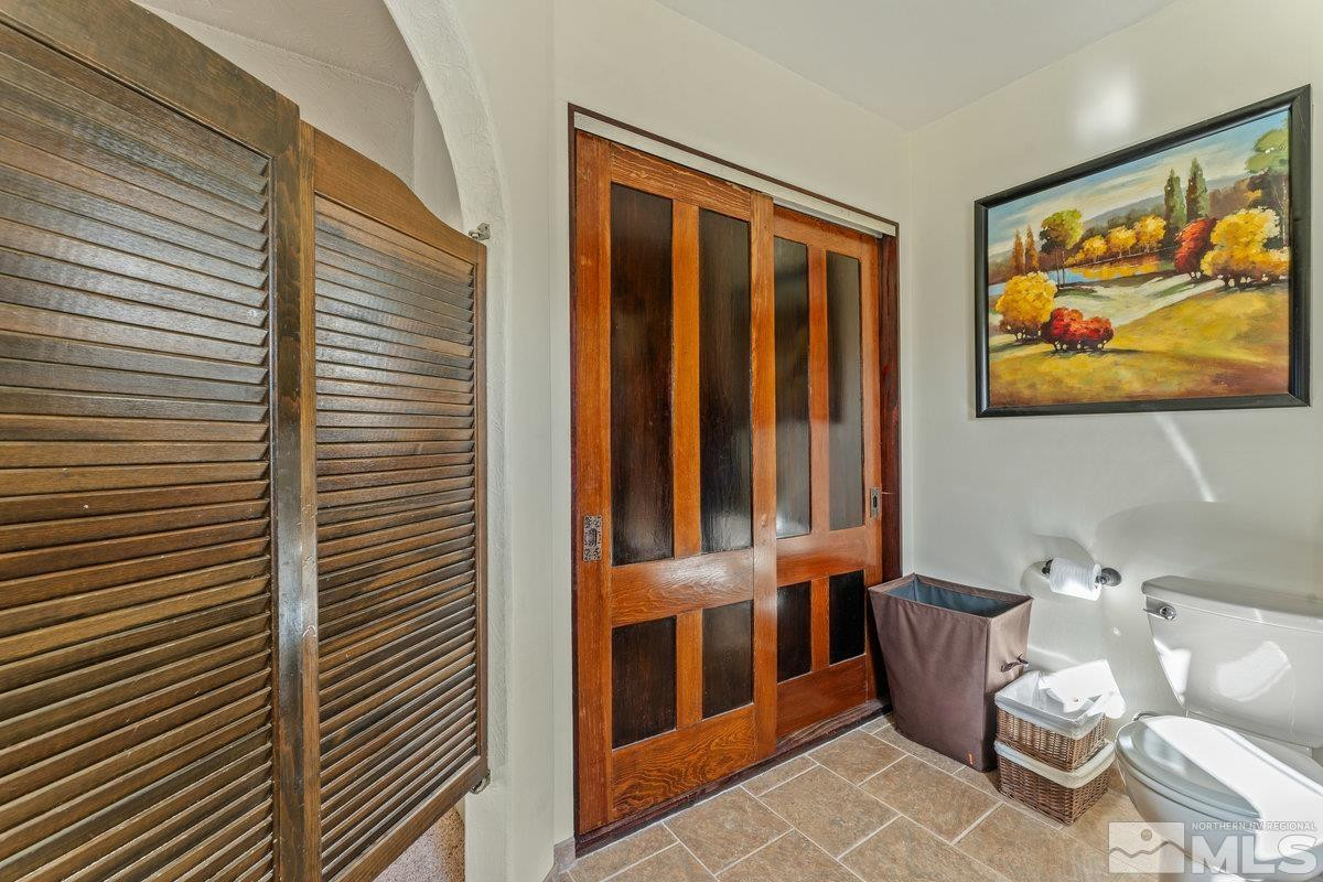 10977 Austin Road Austin, NV 89310 - Photo 14 of 40 a blue bench sitting in front of a door