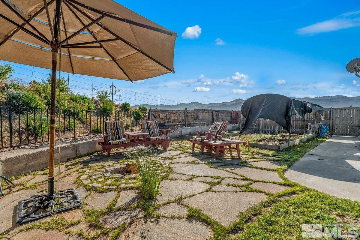10977 Austin Road Austin, NV 89310 - Photo 15 of 40 a view of a patio with table and chairs under an umbrella