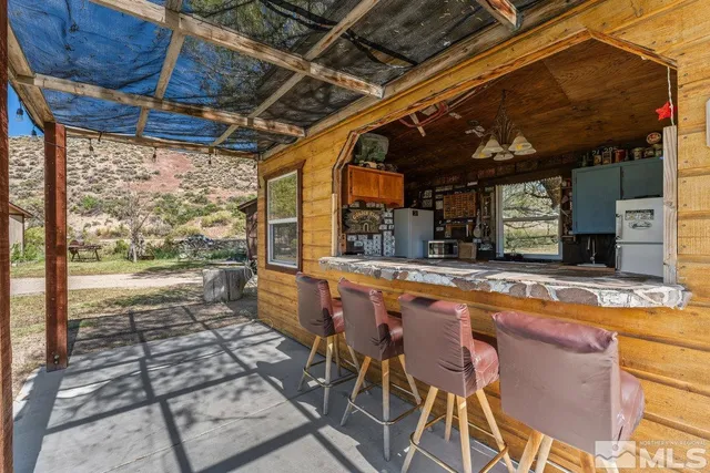 a view of swimming pool with outdoor seating