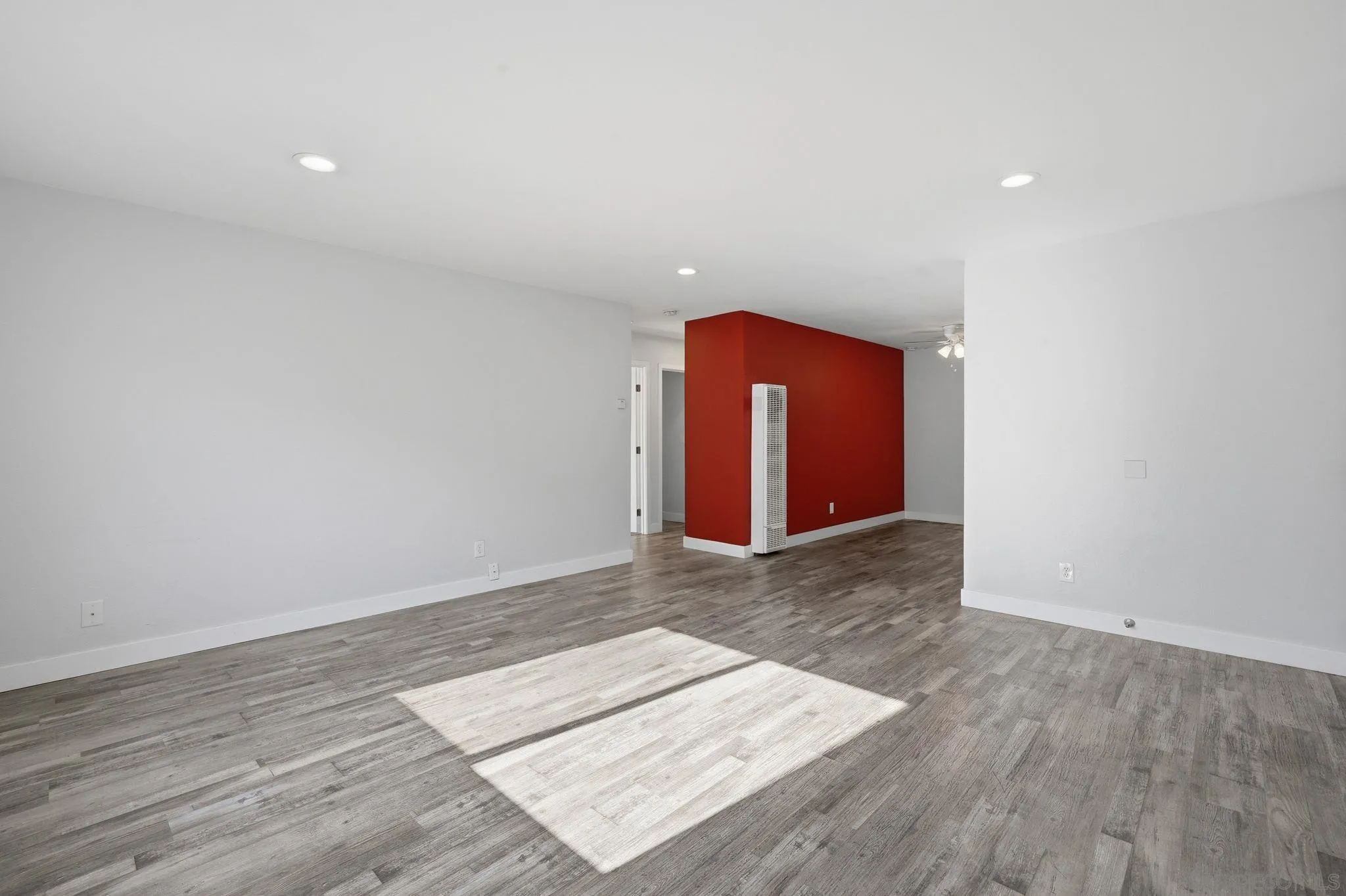 293 Sycamore Road, Unit 15 San Ysidro, CA 92173 - Photo 4 of 25 an empty room with wooden floor and windows