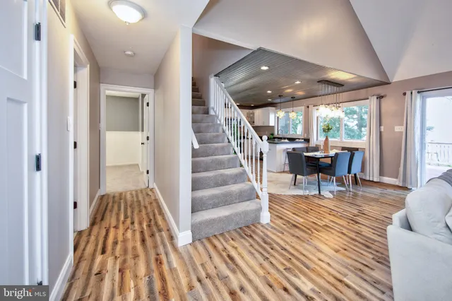 an empty room with a window and a ceiling fan