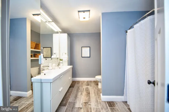 a bed room with a bed and a chandelier