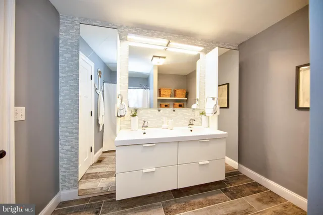 a bed room with a bed and a chandelier