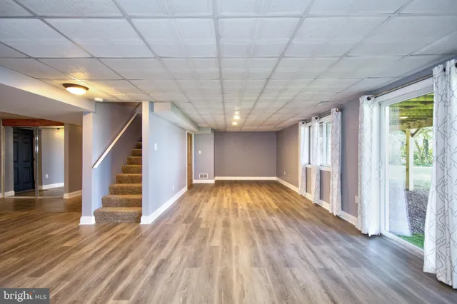 a view of a lake with outdoor seating space