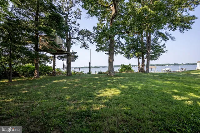 a kitchen with granite countertop a sink and a stove top oven