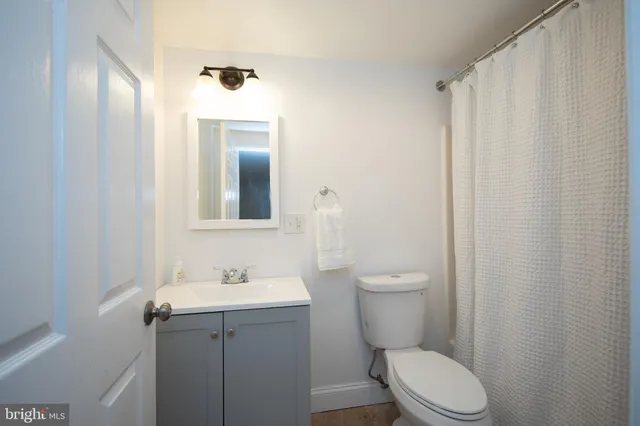 a view of a porch with wooden floor and windows