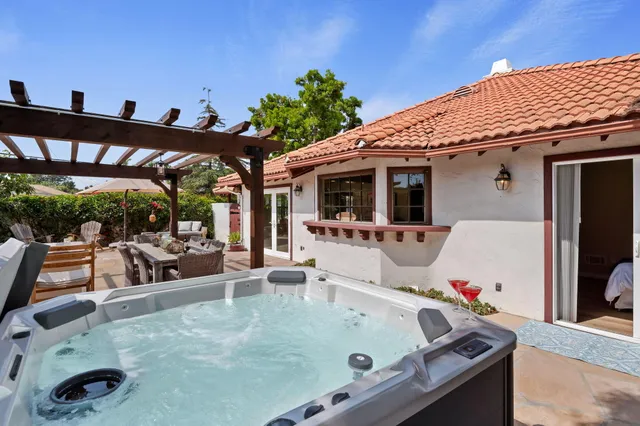 a view of a patio with swimming pool table and chairs