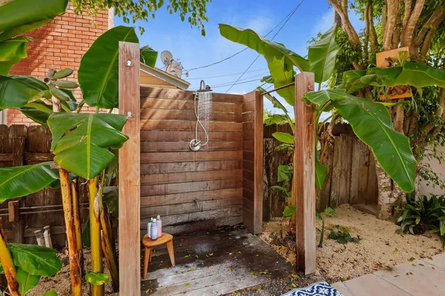 a view of a patio with table and chairs