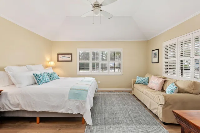 a bedroom with a bed and a couch