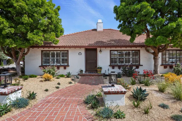 a front view of a house with a sitting area