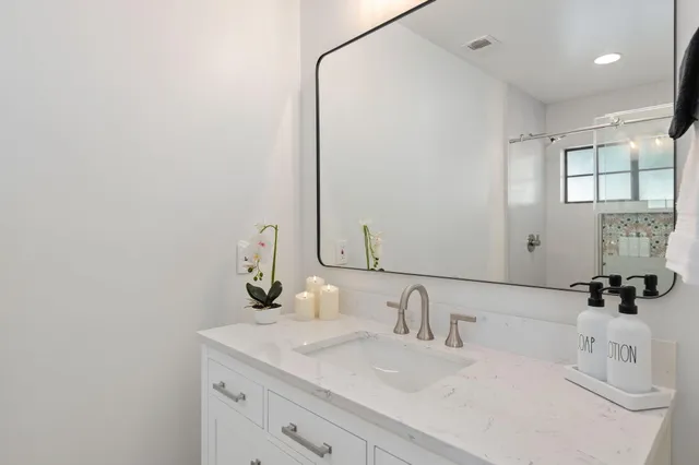 a bathroom with a toilet and shower