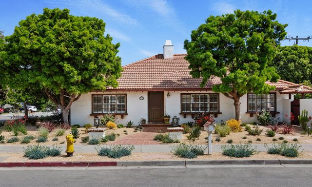 front view of a house with a small yard