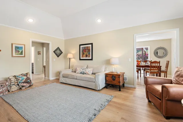 a living room with furniture and a lamp