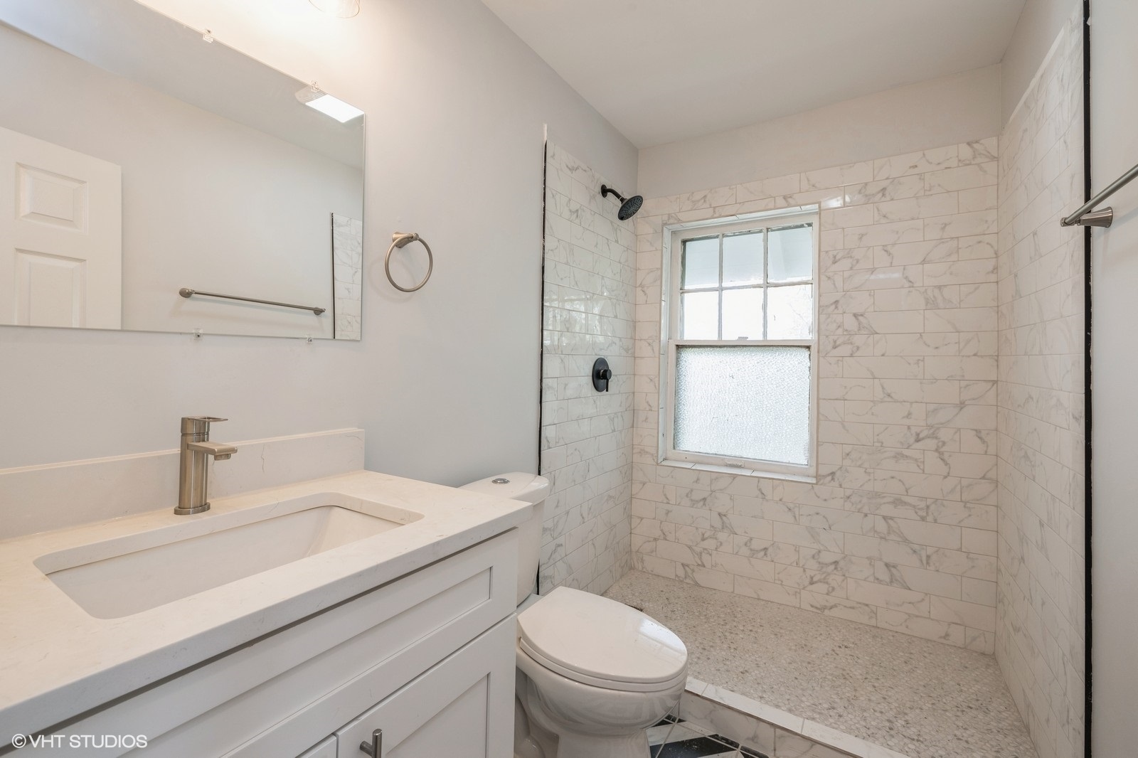 78 Pine Avenue Riverside, IL 60546 - Photo 13 of 13 a bathroom with a sink toilet vanity and shower