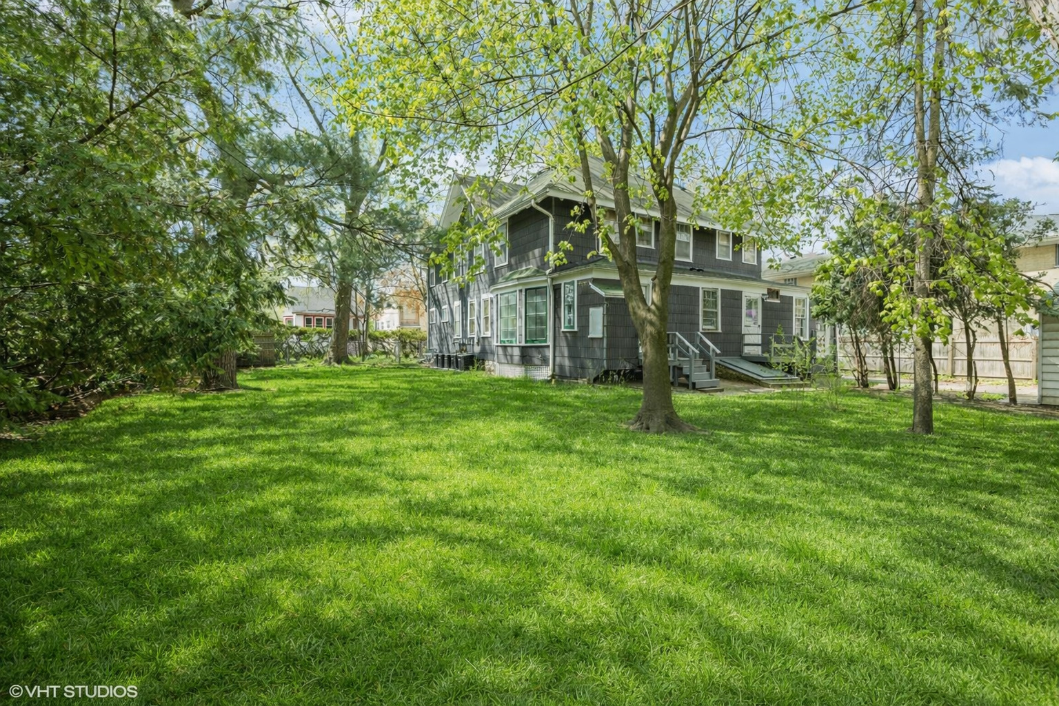 78 Pine Avenue Riverside, IL 60546 - Photo 5 of 13 a front view of a house with a garden