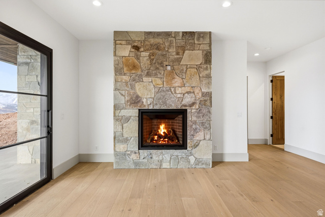 2155 East Wrangler Road Kamas, UT 84036 - Photo 25 of 62 Detailed view of wood finished floors, a fireplace, and recessed lighting