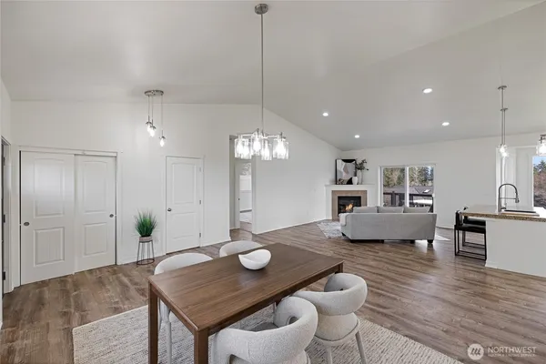 a view of a big room with wooden floor and a window