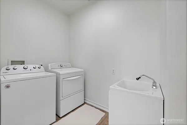 a view of a deck with chairs next to a yard