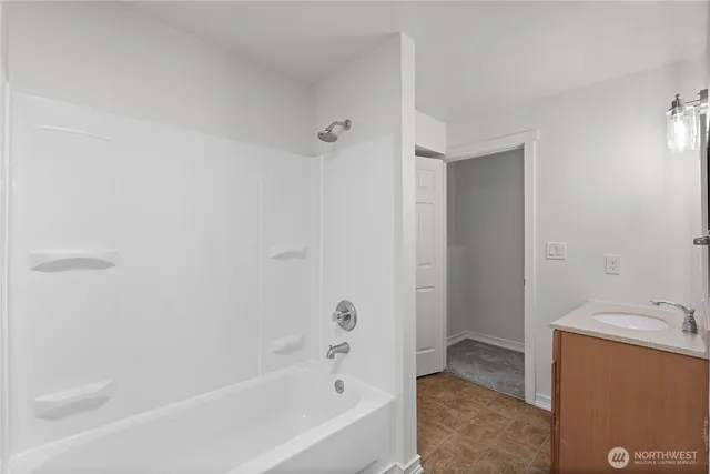 a bathroom with a bathtub and a sink