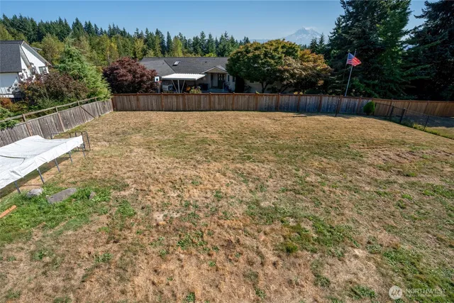 a swimming pool with wooden fence